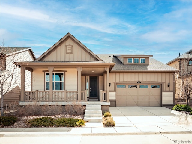 view of front of house featuring covered porch, board and batten siding, concrete driveway, roof with shingles, and a garage