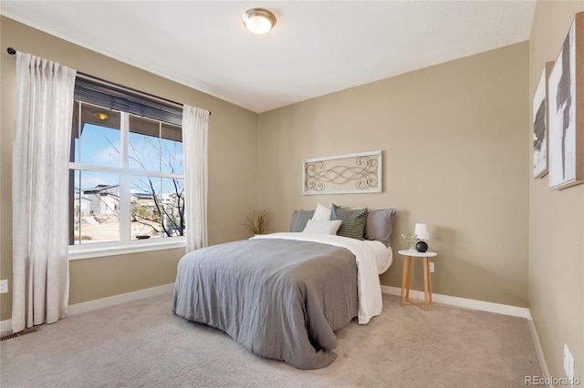 bedroom featuring carpet flooring and baseboards