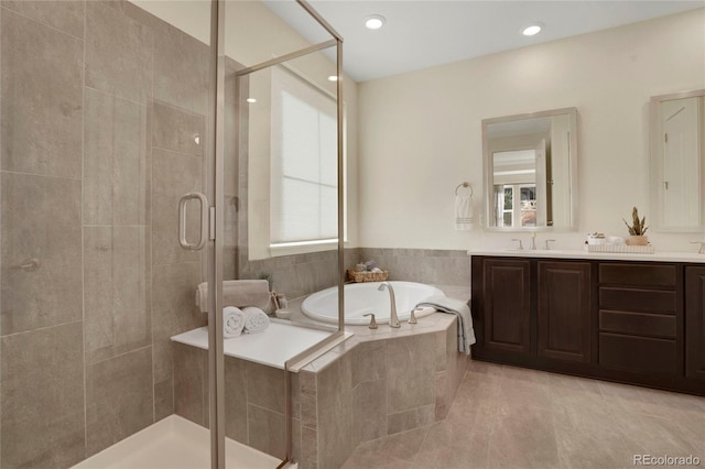 full bathroom featuring recessed lighting, a bath, a shower stall, tile patterned flooring, and vanity