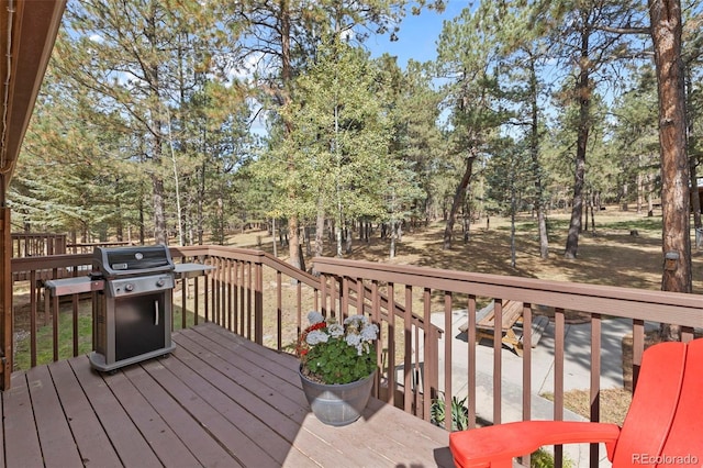 wooden deck with a grill