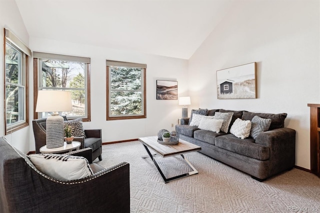 carpeted living room with lofted ceiling