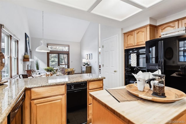 kitchen with pendant lighting, black appliances, vaulted ceiling, light stone countertops, and a kitchen island