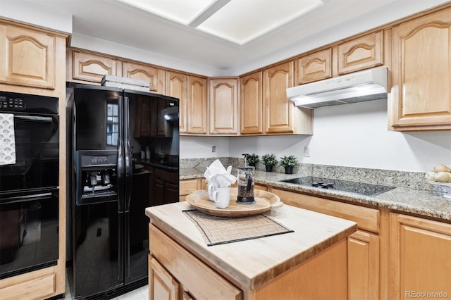 kitchen with light brown cabinets, a kitchen island, and black appliances