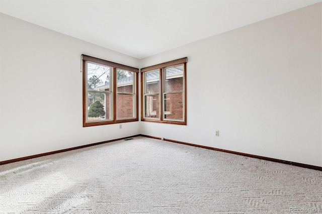 unfurnished room with carpet floors