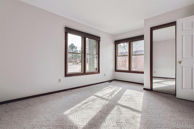 unfurnished bedroom with light colored carpet