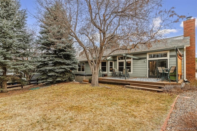 rear view of house with a deck