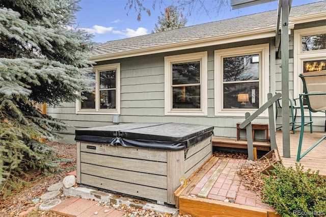 exterior space with a hot tub