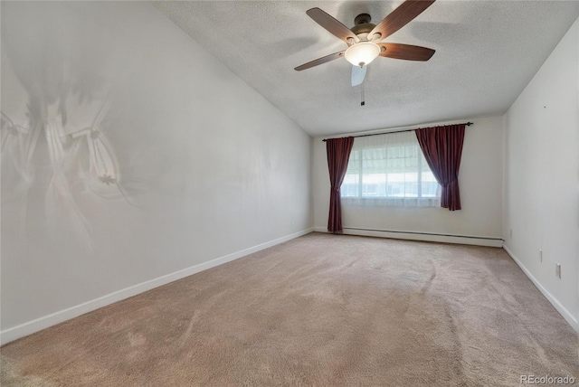 carpeted spare room featuring ceiling fan, a baseboard radiator, and a textured ceiling