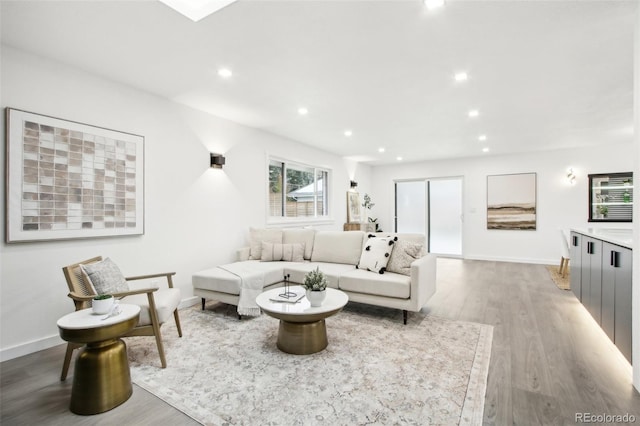 5886 S Logan St, Centennial, CO 80121 - living area with wood finished floors and recessed lighting