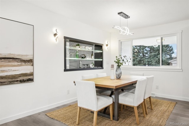 5886 S Logan St, Centennial, CO 80121 - dining space with wood finished floors and a chandelier