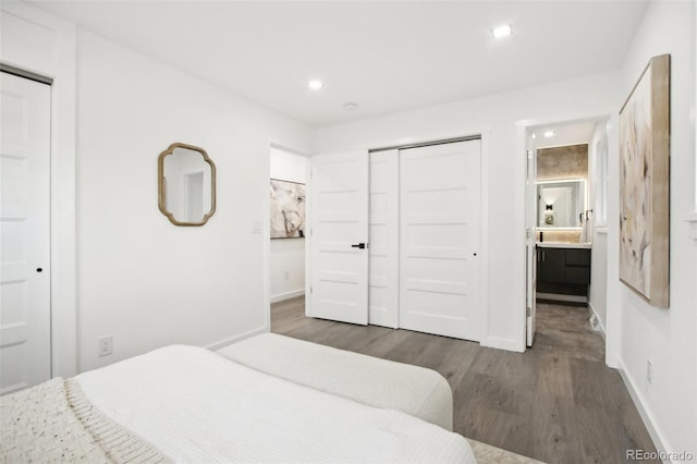5886 S Logan St, Centennial, CO 80121 - bedroom featuring wood finished floors, a closet, recessed lighting, and connected bathroom
