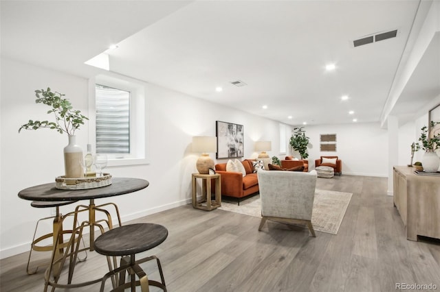 5886 S Logan St, Centennial, CO 80121 - living room with light wood finished floors and recessed lighting