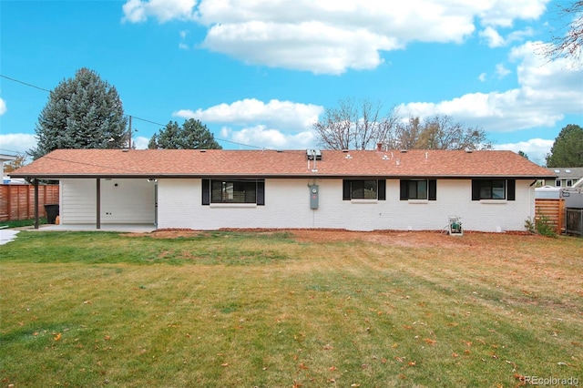 5886 S Logan St, Centennial, CO 80121 - rear view of house featuring brick siding and a patio