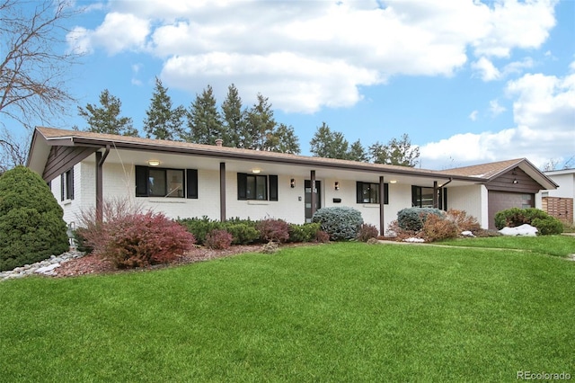 5886 S Logan St, Centennial, CO 80121 - single story home with an attached garage, a front lawn, and brick siding