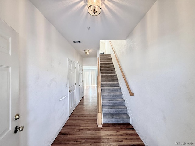 staircase featuring hardwood / wood-style flooring