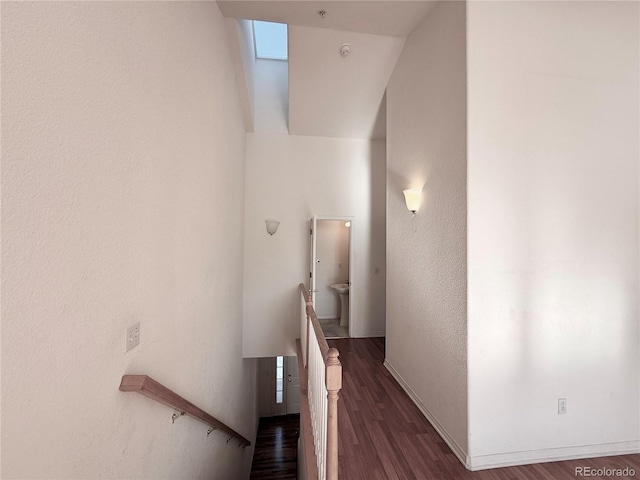 hallway with dark hardwood / wood-style floors