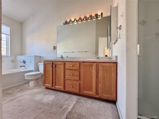 full bathroom with vanity, toilet, and separate shower and tub