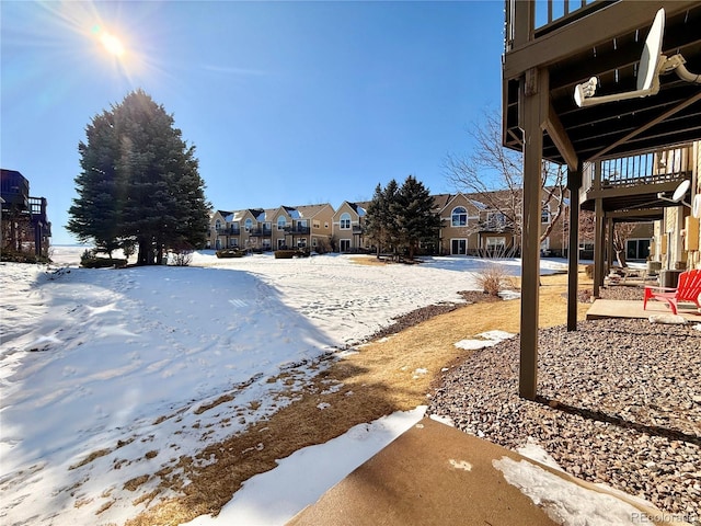 view of yard covered in snow