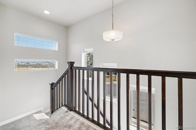 staircase with baseboards, carpet floors, and recessed lighting