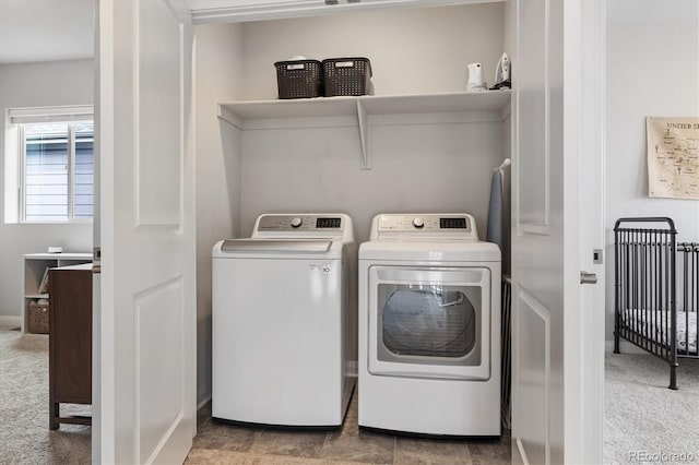 laundry area with washing machine and clothes dryer, carpet, and laundry area