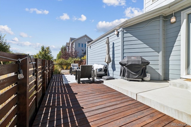 wooden deck with grilling area