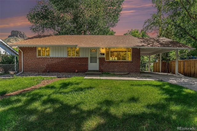 2017 Jackson St, Golden, CO 80401 - ranch-style house featuring brick siding, a carport, driveway, board and batten siding, and roof with shingles