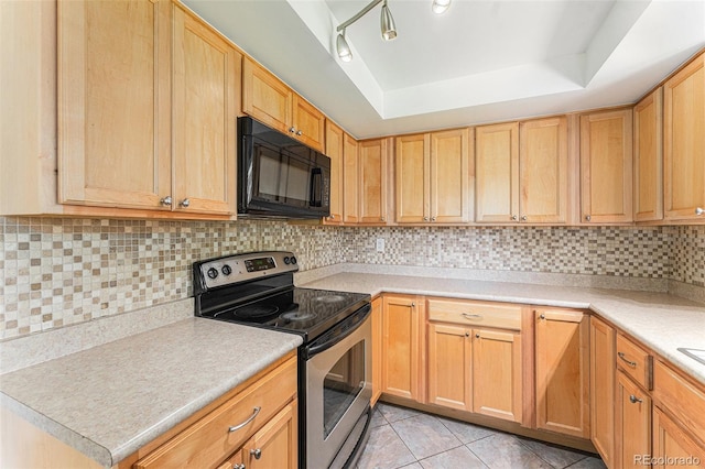 2017 Jackson St, Golden, CO 80401 - kitchen with stainless steel range with electric stovetop, black microwave, a raised ceiling, light countertops, and light tile patterned floors