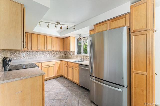 2017 Jackson St, Golden, CO 80401 - kitchen featuring stainless steel appliances, light brown cabinets, tasteful backsplash, light countertops, and light tile patterned flooring