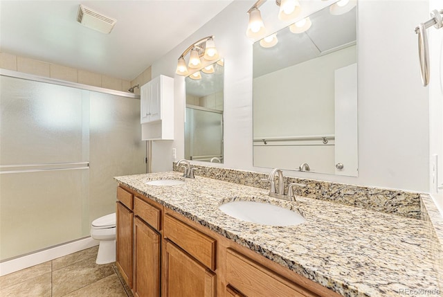 2017 Jackson St, Golden, CO 80401 - full bathroom with a stall shower, double vanity, and tile patterned floors