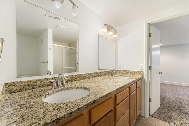 2017 Jackson St, Golden, CO 80401 - full bathroom with double vanity, an enclosed shower, and tile patterned flooring