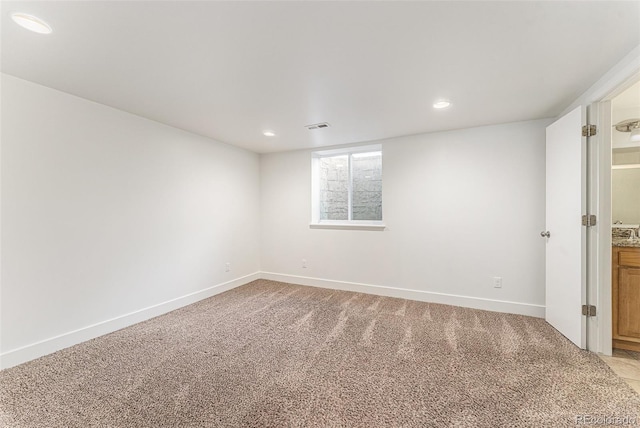2017 Jackson St, Golden, CO 80401 - spare room featuring light colored carpet and recessed lighting