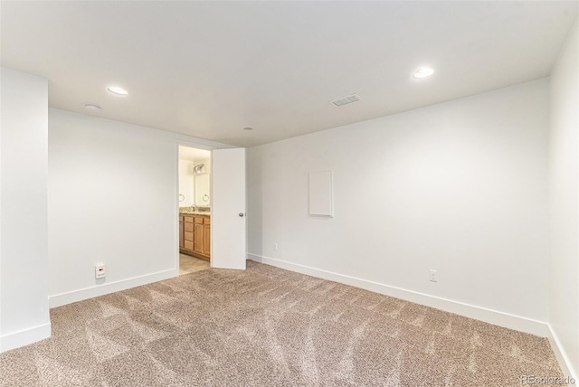 2017 Jackson St, Golden, CO 80401 - unfurnished room featuring light colored carpet and recessed lighting