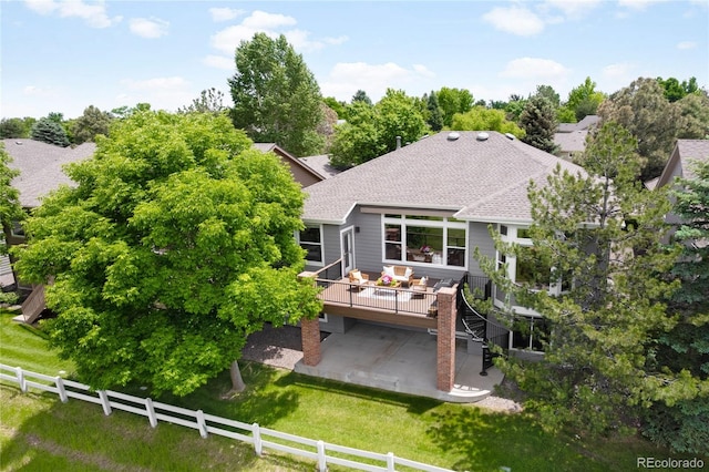 1001 Deer Clover Way, Castle Pines, CO 80108 - rear view of house featuring a patio, a wooden deck, a shingled roof, and stairs