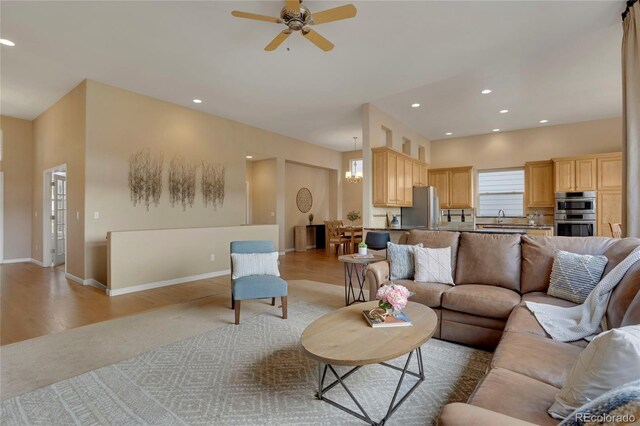 1001 Deer Clover Way, Castle Pines, CO 80108 - living area featuring a ceiling fan, recessed lighting, and light wood-style floors