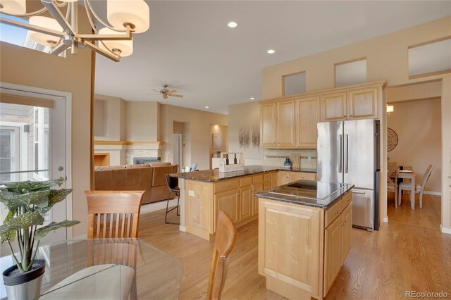 1001 Deer Clover Way, Castle Pines, CO 80108 - kitchen featuring freestanding refrigerator, light brown cabinets, a center island, light wood-type flooring, and recessed lighting