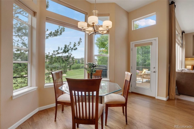1001 Deer Clover Way, Castle Pines, CO 80108 - dining area featuring light wood-style flooring and a chandelier