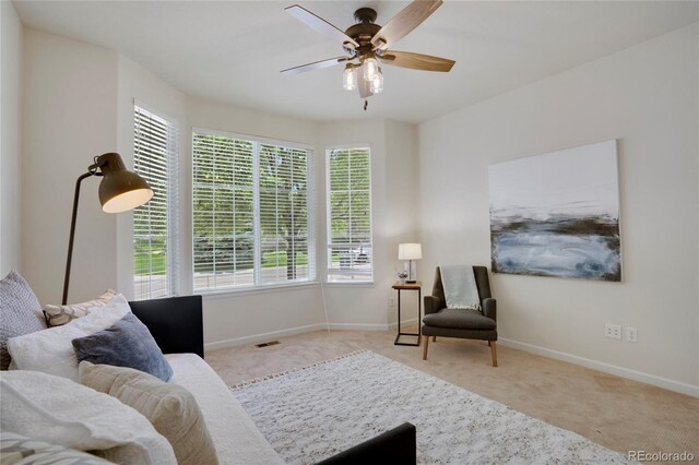 1001 Deer Clover Way, Castle Pines, CO 80108 - carpeted living area with a ceiling fan and baseboards