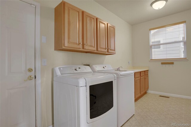 1001 Deer Clover Way, Castle Pines, CO 80108 - washroom featuring independent washer and dryer, light floors, and cabinet space