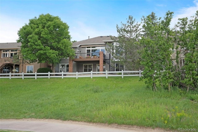 1001 Deer Clover Way, Castle Pines, CO 80108 - back of house with a wooden deck and stairway