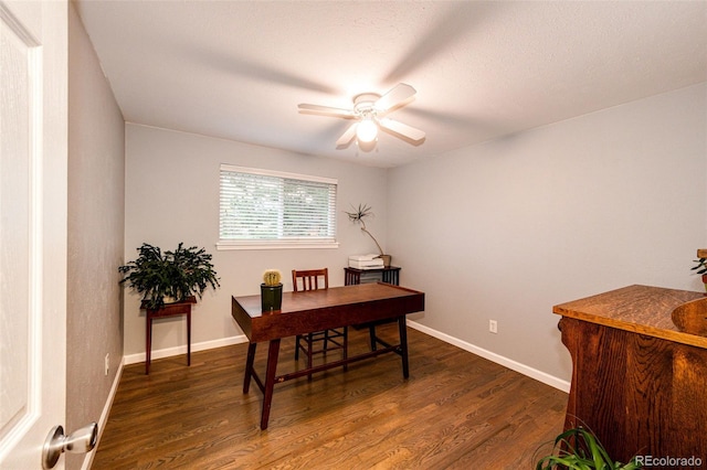 office area featuring baseboards, a ceiling fan, and wood finished floors