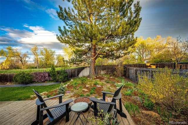 view of yard featuring a fenced backyard and a deck