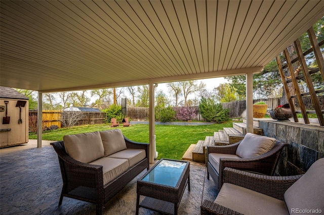 view of patio with an outdoor living space and a fenced backyard
