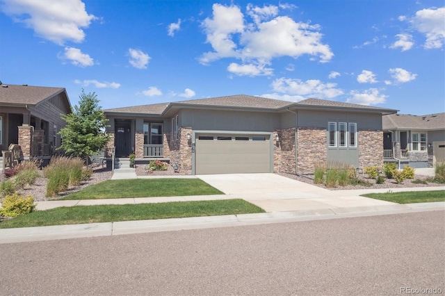 1976 Canyonpoint Ln, Castle Pines, CO 80108 - prairie-style home with an attached garage, concrete driveway, and stone siding