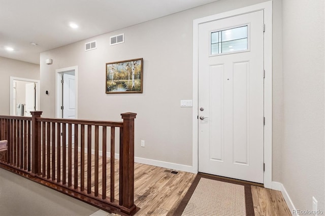 1976 Canyonpoint Ln, Castle Pines, CO 80108 - foyer with light wood-style floors and recessed lighting