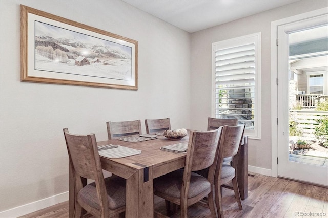 1976 Canyonpoint Ln, Castle Pines, CO 80108 - dining area with light wood-type flooring and baseboards