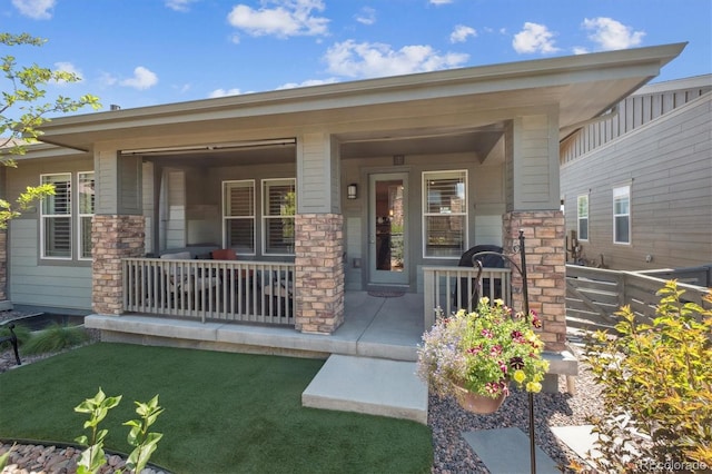 1976 Canyonpoint Ln, Castle Pines, CO 80108 - doorway to property with a porch and stone siding