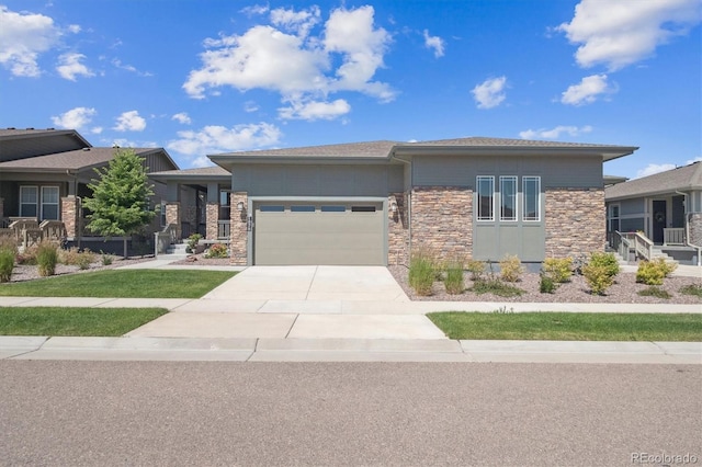 1976 Canyonpoint Ln, Castle Pines, CO 80108 - prairie-style house with stone siding, a garage, and driveway
