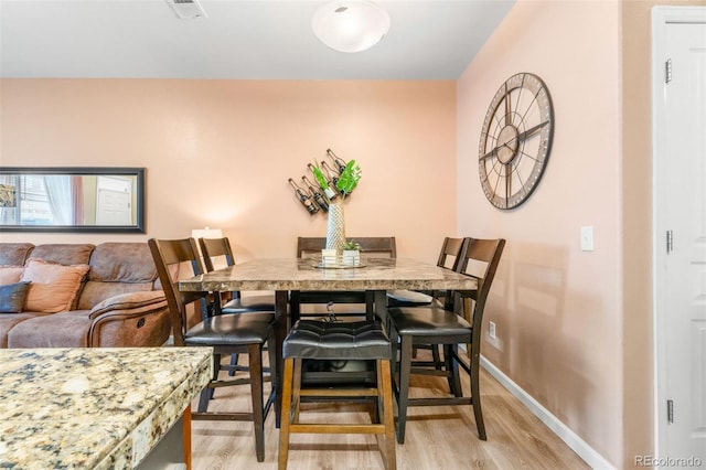 dining room featuring light hardwood / wood-style flooring