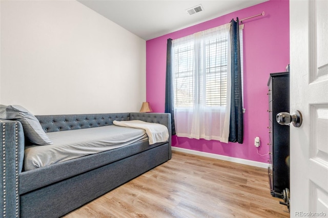 bedroom featuring wood-type flooring