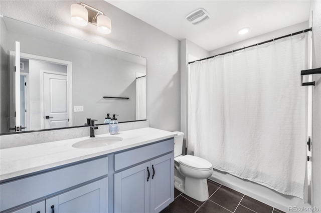 full bathroom with shower / bath combination with curtain, visible vents, toilet, vanity, and tile patterned flooring